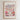 The image is a framed poster depicting a cityscape with a variety of colorful flowers in the foreground.