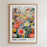 The image is a framed poster depicting a vibrant and colorful flower market in Orlando, Florida.