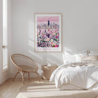 A bedroom with a large poster of a city skyline and a bed with white bedding.