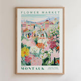 The image is a framed poster depicting a vibrant and colorful flower market in Montauk, New York.