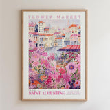 The image is a framed poster depicting a colorful and vibrant flower market in Saint Augustine, Florida.