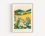 A framed illustration of a field of flowers with a mountainous landscape in the background, depicting the state of Kentucky.