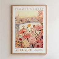 The image is a framed poster depicting a cityscape with a river and a flower market in the background.