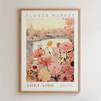 The image is a framed poster depicting a cityscape with a river and a flower market in the background.