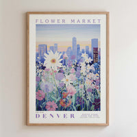 The image is a framed poster depicting a cityscape with a field of colorful flowers in the foreground.