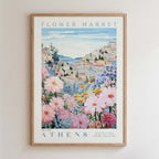 The image is a framed poster depicting a scenic view of the city of Athens, Greece, with colorful flowers and buildings in the background.