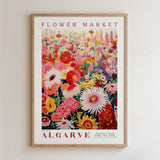 The image is a framed poster of a vibrant floral arrangement, featuring a variety of colorful flowers and plants.