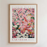 The image is a framed poster of a flower market in Las Vegas, featuring a vibrant and colorful collage of various flowers and plants.