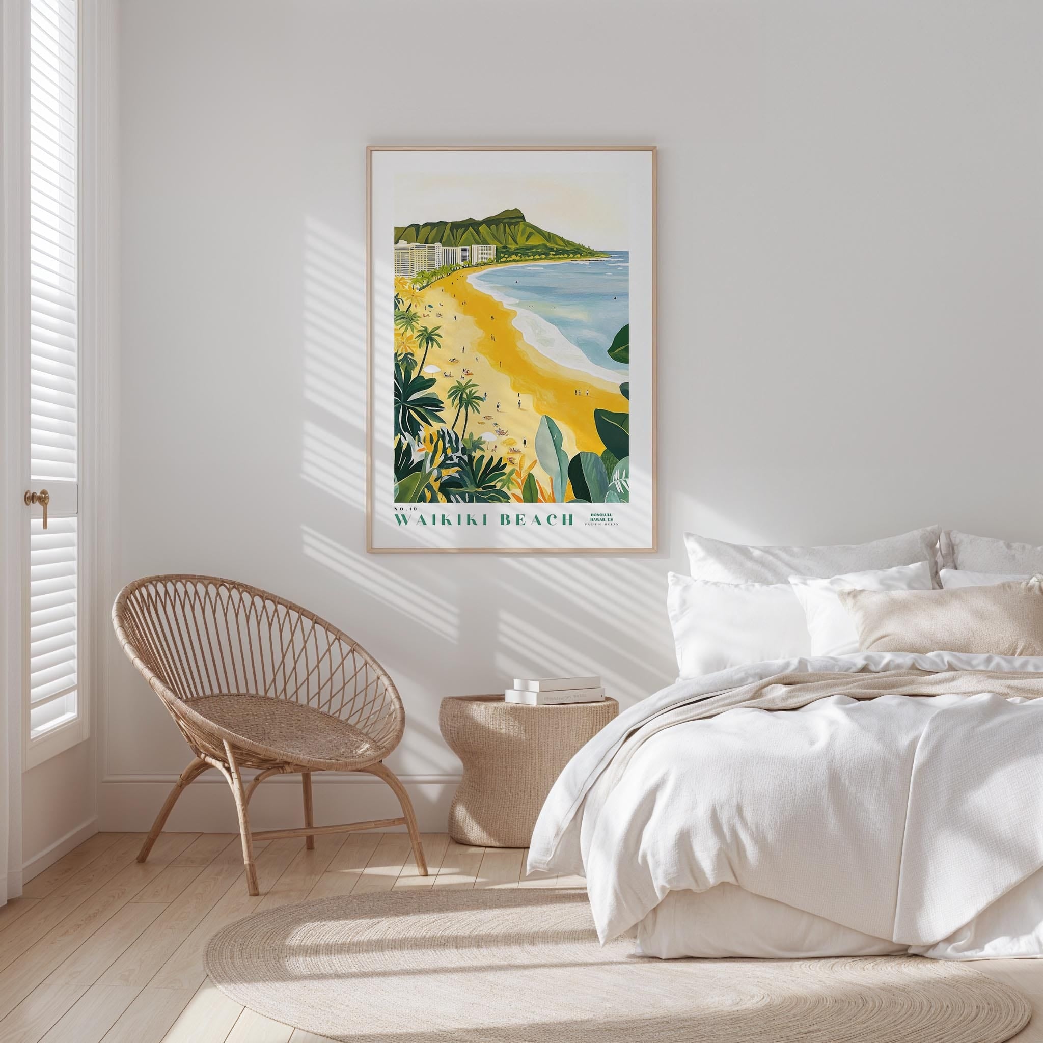 a serene bedroom scene with a large poster of Waikiki Beach hanging on the wall, a wicker chair, and a white bed with a beige blanket.