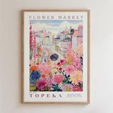 The image is a framed poster depicting a vibrant and colorful flower market in Topeka, Kansas.