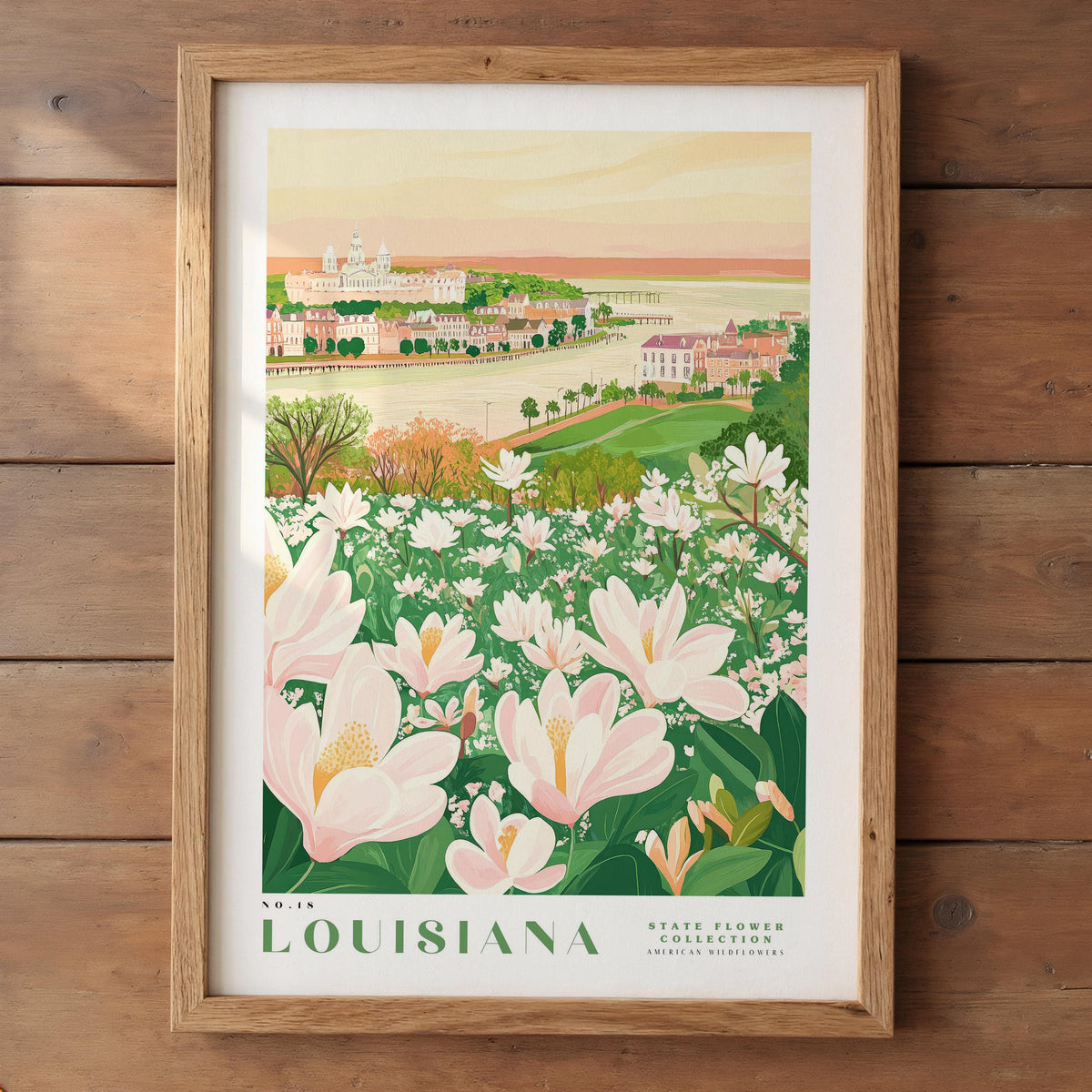 A framed illustration of a scenic landscape in Louisiana, featuring a town surrounded by a river and lush greenery with blooming flowers.