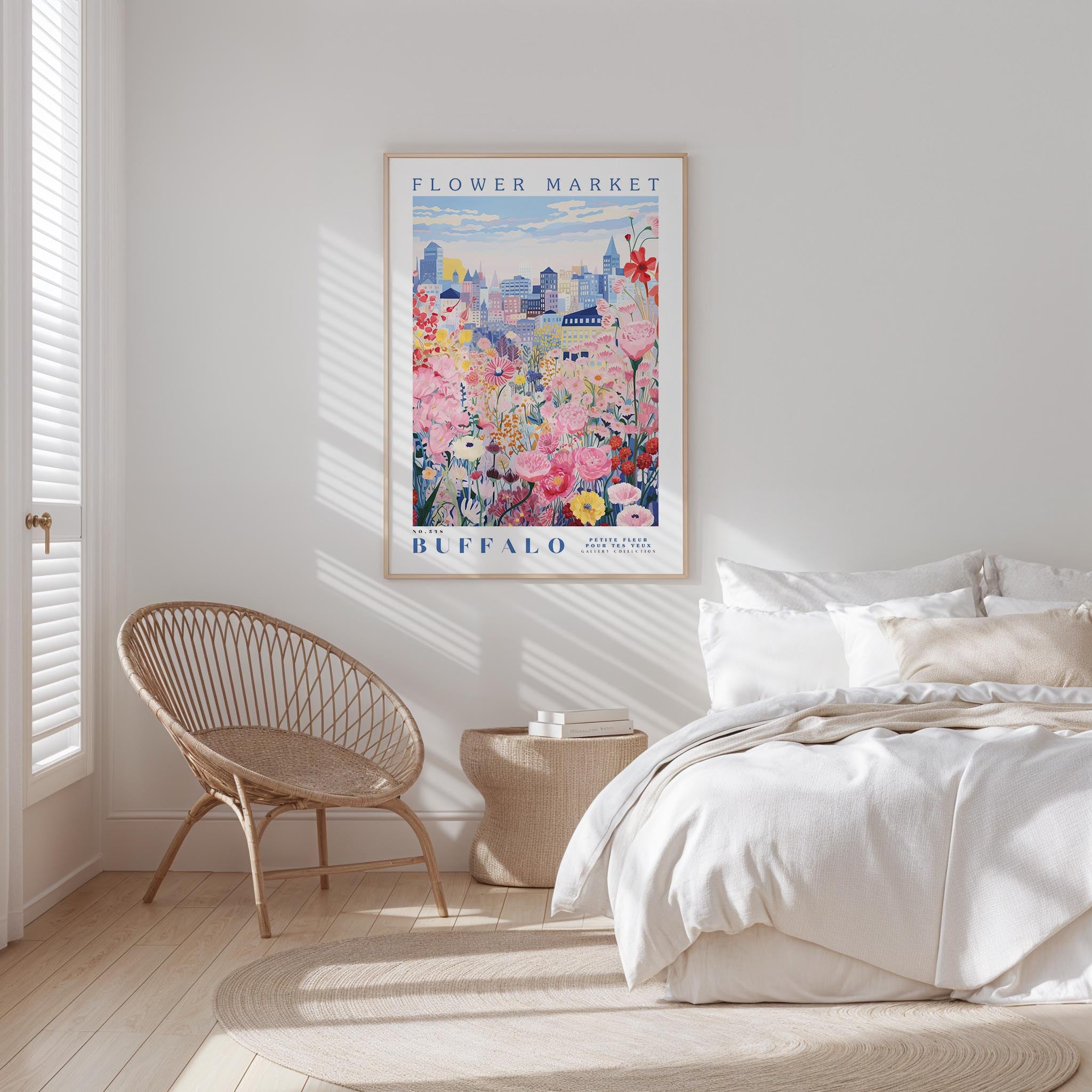 a bedroom with a large poster of a colorful floral scene hanging on the wall above a bed with white bedding.