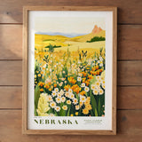 The image is a framed poster depicting a vibrant field of flowers, with a mountainous landscape in the background.