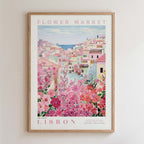 The image is a framed poster depicting a colorful and vibrant scene of a flower market in Lisbon, Portugal.