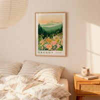a bedroom scene with a framed poster of a mountain landscape hanging on the wall above a bed with striped pillows.
