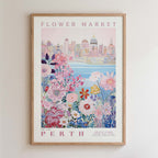 The image is a framed poster depicting a cityscape with a flower market in the background.