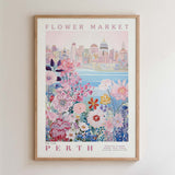 The image is a framed poster depicting a cityscape with a flower market in the background.