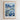 The image is a framed poster depicting a cityscape with a field of flowers in the foreground.