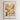 The image is a framed poster depicting a vibrant and colorful flower market in Zanzibar, featuring a variety of flowers and plants in different shades of orange, yellow, and white.
