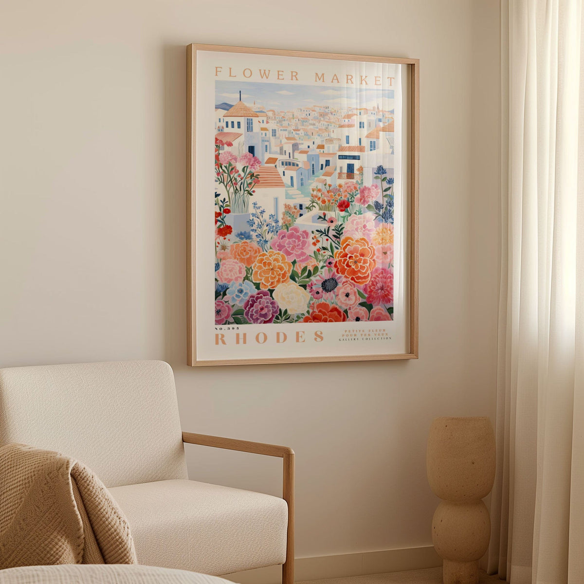 a framed poster of a colorful floral scene hanging on a wall, with a white armchair and a beige vase in the foreground.