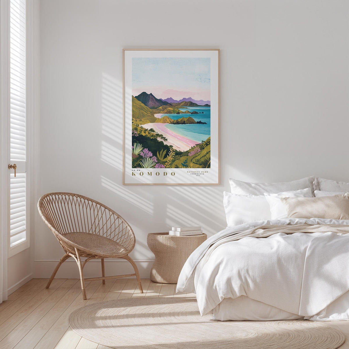 a serene bedroom scene with a large framed poster of a tropical beach landscape hanging on the wall, a woven chair, and a neatly made bed with white bedding.
