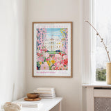 a framed poster of the Washington Monument, a famous landmark in Washington, D.C., hanging on a wall.