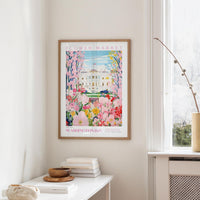 a framed poster of the Washington Monument, a famous landmark in Washington, D.C., hanging on a wall.