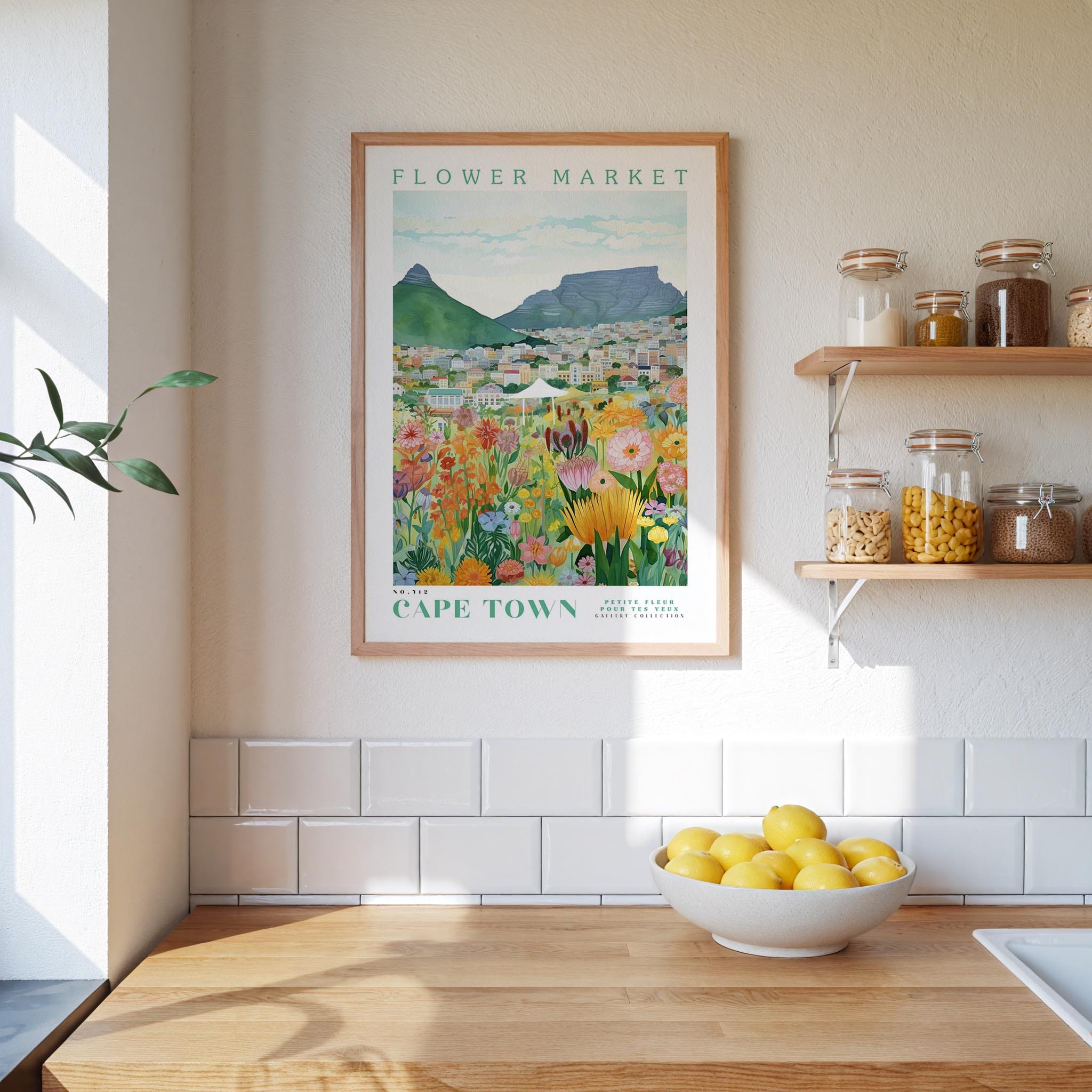 a framed poster of a colorful flower market in Cape Town, with a wooden shelf below it holding various jars and containers.