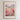 The image is a framed poster depicting a cityscape with a field of colorful flowers in the foreground.