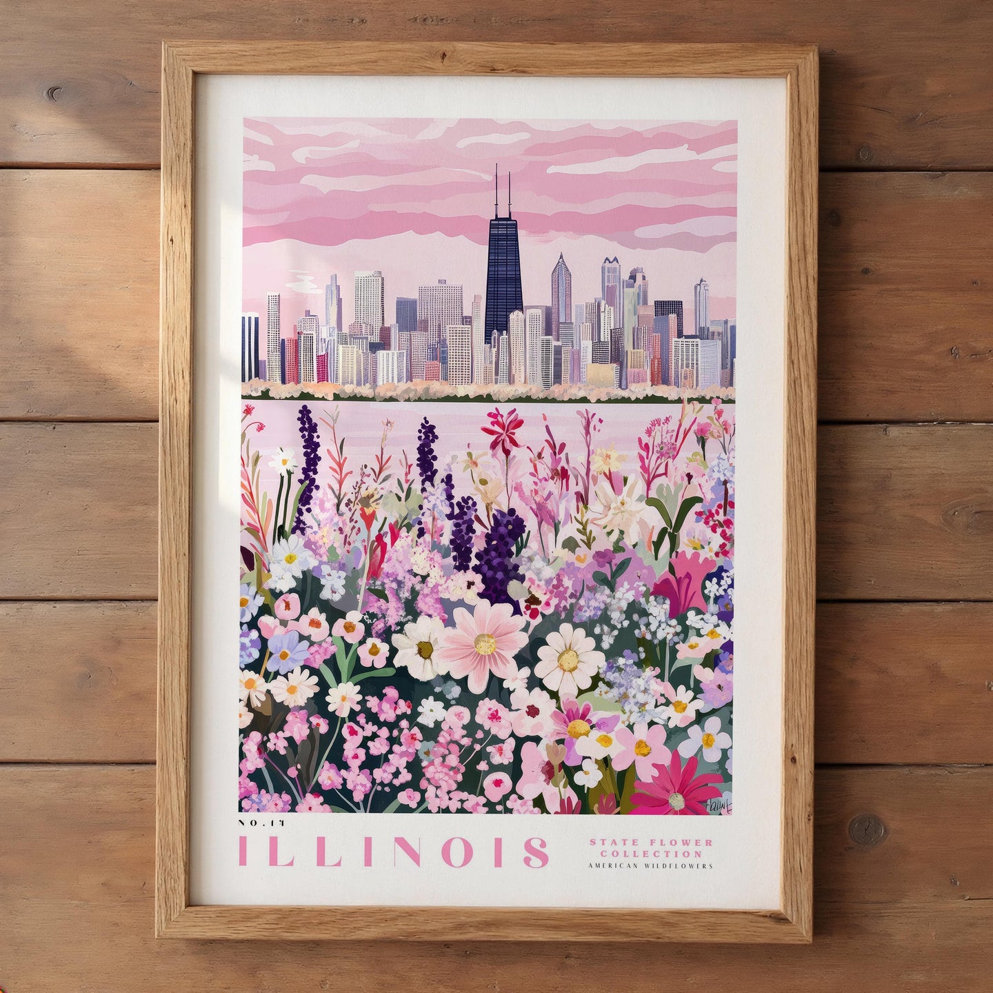 A framed poster depicting a cityscape with a field of colorful flowers in the foreground, representing the state flower of Illinois.