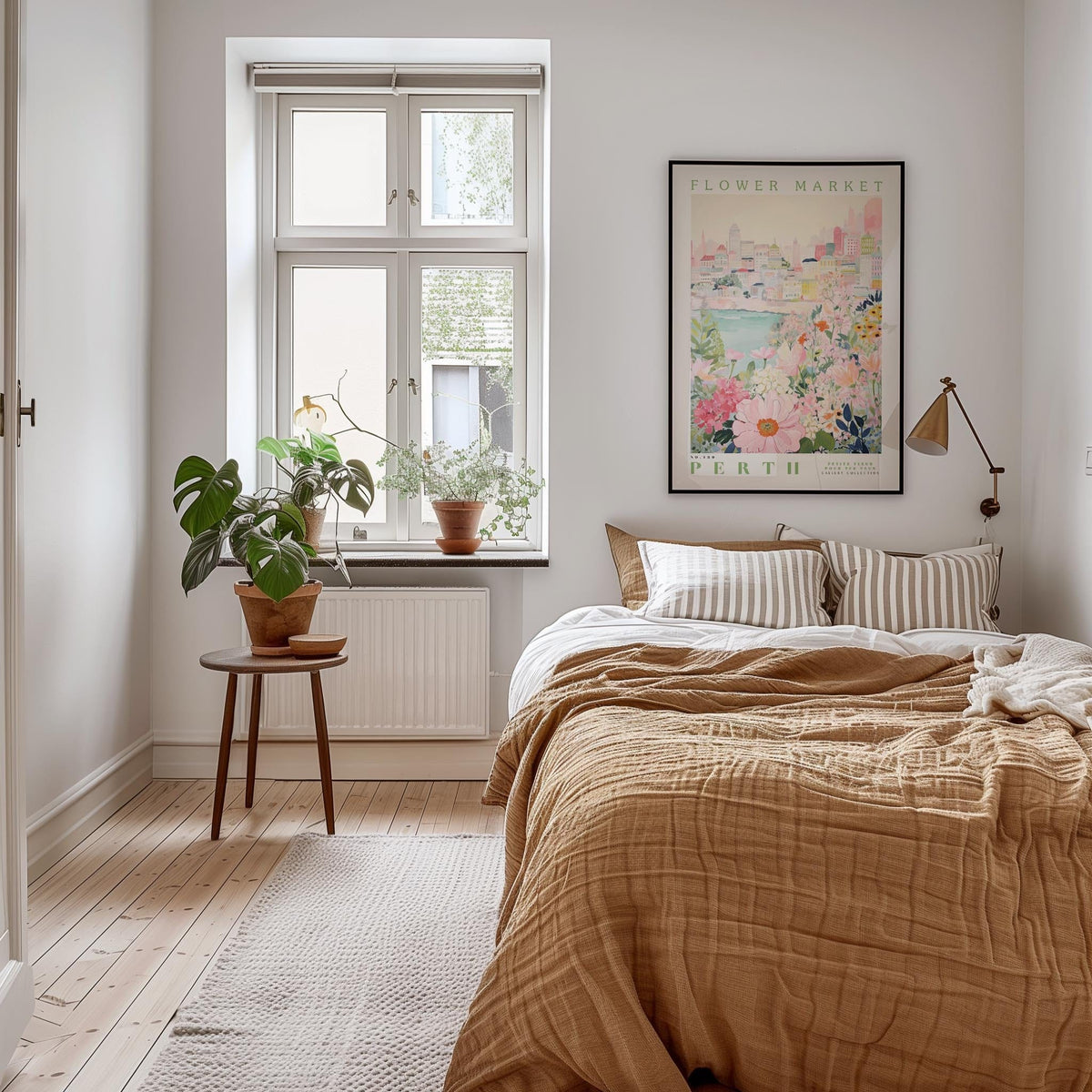 a cozy bedroom with a large bed, a nightstand with a potted plant, and a framed poster of a cityscape on the wall.