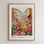 The image is a framed poster depicting a vibrant and colorful flower market in Helsinki, Finland.