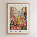 The image is a framed poster depicting a vibrant and colorful flower market in Helsinki, Finland.