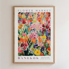 The image is a framed poster depicting a vibrant and colorful floral scene, likely from a flower market in Bangkok.