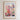 The image is a framed poster advertising a flower market in New York City. It features a vibrant illustration of a flower market with various types of flowers and plants, set against the backdrop of a city skyline.