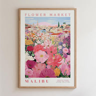 The image is a framed poster depicting a vibrant and colorful flower market in Malibu, California.