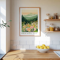a framed poster of a mountain landscape with flowers hanging on a wall above a wooden countertop with a bowl of lemons.