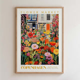 The image is a framed poster depicting a vibrant and colorful flower market in Copenhagen, Denmark.