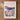 The image is a framed poster depicting a vibrant field of colorful wildflowers, with mountains in the background.