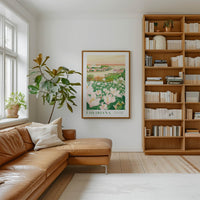 a cozy living room with a large window, a comfortable leather sofa, a wooden bookshelf filled with books, and a framed poster of a field of flowers hanging on the wall.