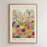 The image is a framed poster depicting a vibrant and colorful flower market in Los Angeles.