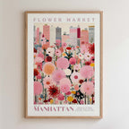 The image is a framed poster depicting a cityscape with a large field of colorful flowers in the foreground.