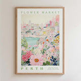 The image is a framed poster depicting a cityscape with a flower market in the background.