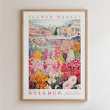 The image is a framed poster depicting a vibrant and colorful flower market in Boulder, Colorado.