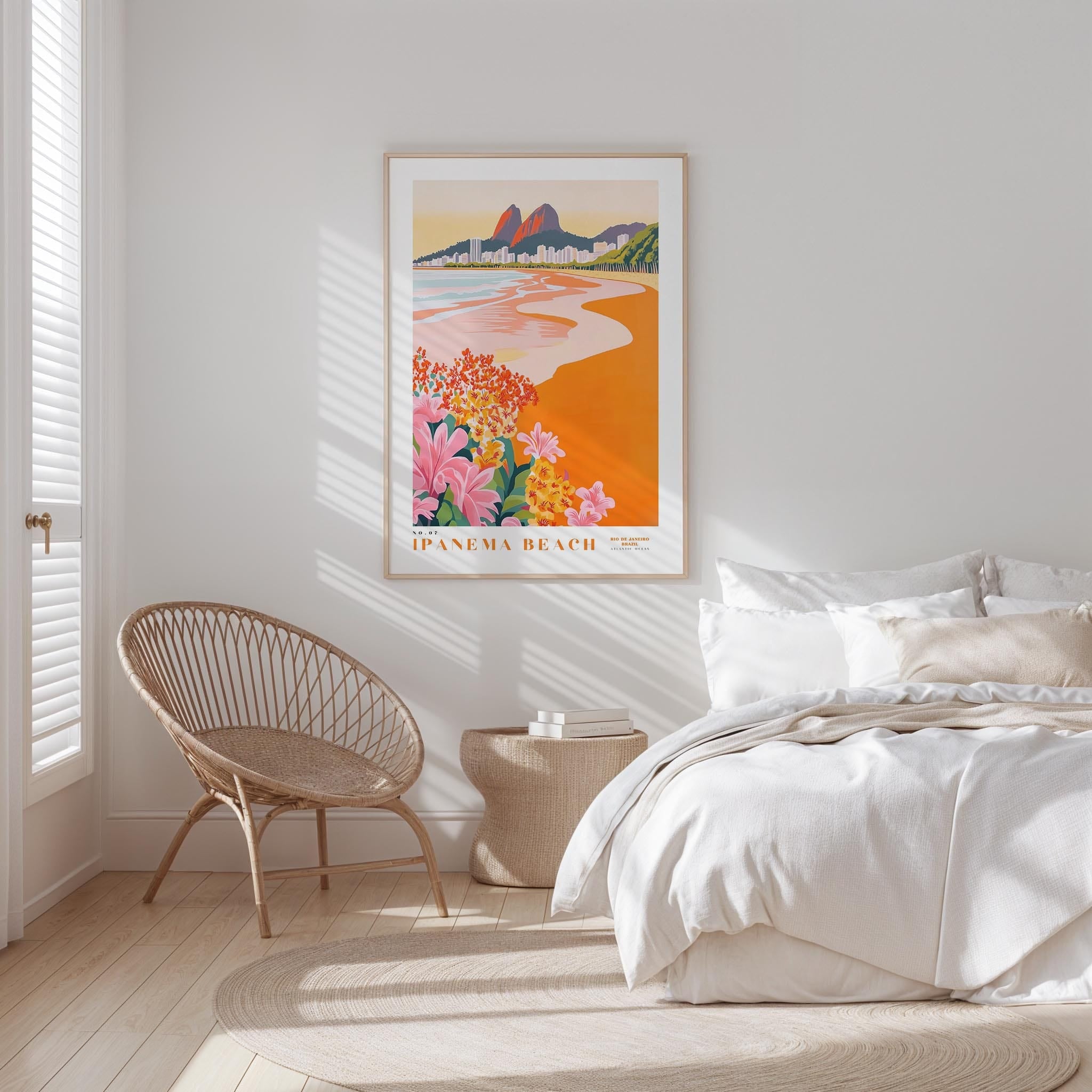 a serene bedroom scene with a large framed poster of the Panama Beach on the wall, a woven chair, and a neatly made bed with white linens.
