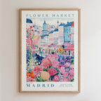The image is a framed poster depicting a colorful and vibrant scene from the Flower Market in Madrid, Spain.