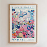 The image is a framed poster depicting a colorful and vibrant scene from the Flower Market in Madrid, Spain.