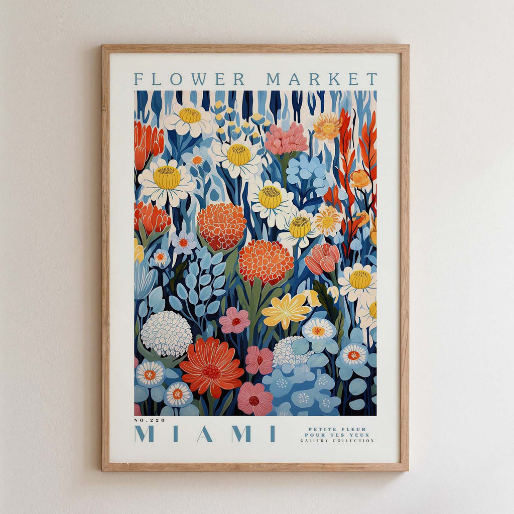 The image is a framed poster of a flower market in Miami, featuring a vibrant and colorful illustration of various flowers and plants.